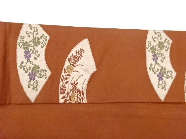  地紙に草花模様織出し名古屋帯